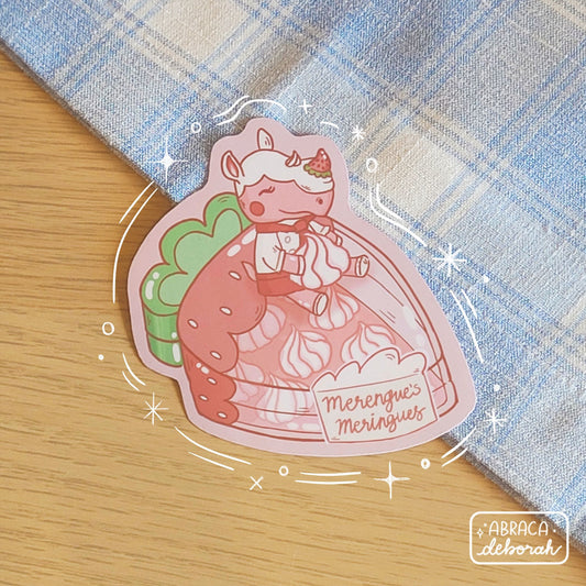 A sticker depicting a pink rhinoceros sitting on a container full of meringues.