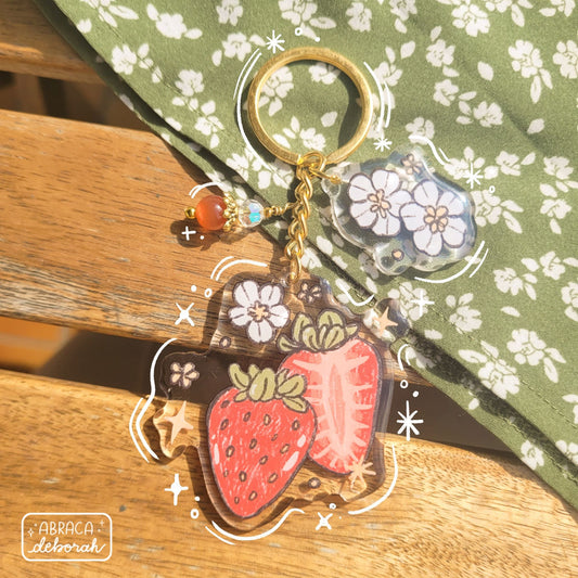 Clear acrylic keychain with beads, flowers and strawberries.