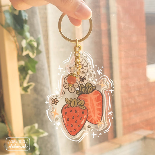 Clear acrylic keychain with beads, flowers and strawberries.