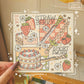 Print of digital illustration. A collage of decorated swords, strawberries, flowers, and strawberry shortcake.