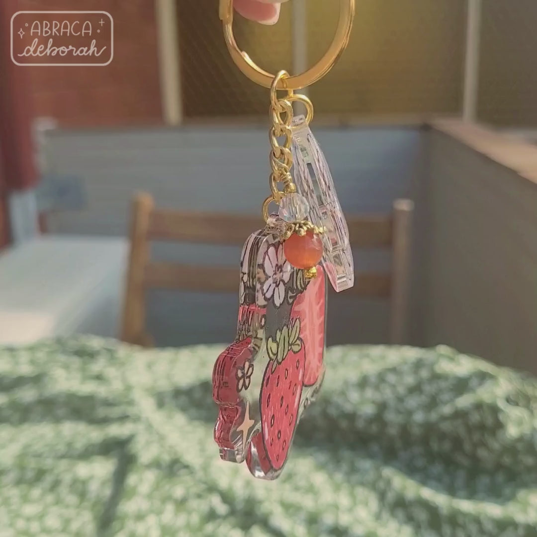 Clear acrylic keychain with beads, flowers and strawberries.