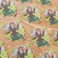 Stickers depicting a female warrior branding two metal fans.
