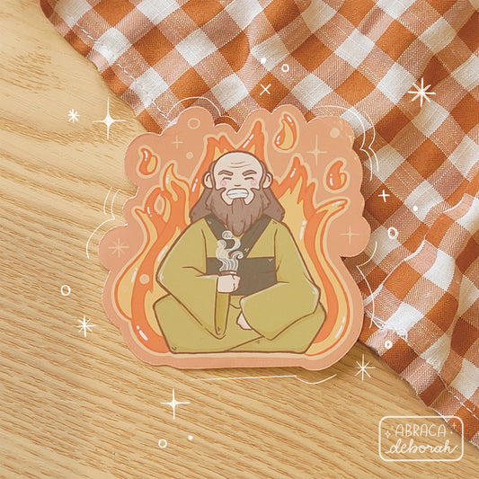 Sticker of an elderly man holding a cup of hot tea. There is a fire behind him.