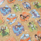 Stickers with different characters on them are laid neatly on a table.